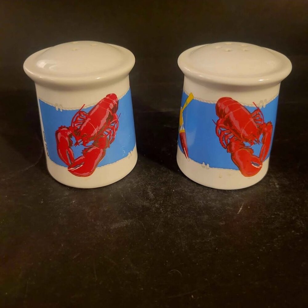 Set Of Ceramic Salt And Pepper Shakers Featuring A Lobster And Buoy Design